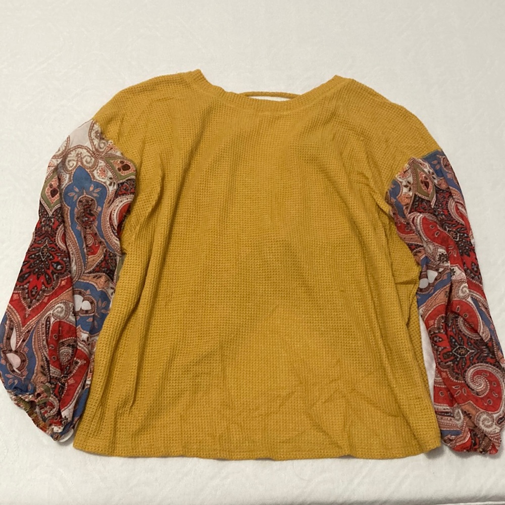 Mustard yellow puffy patterned long sleeved top